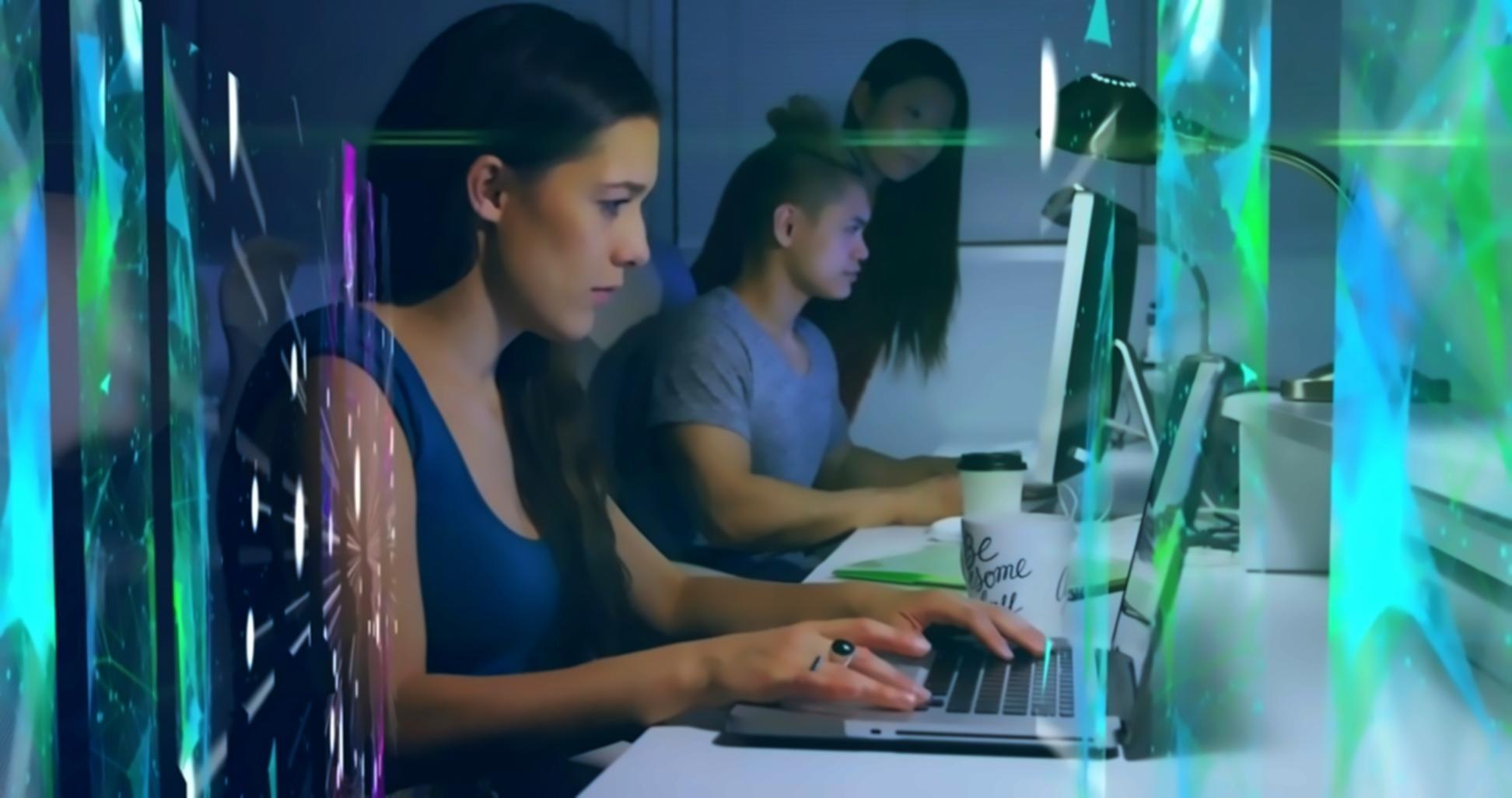 Developer reviewing mobile application interface designs on multiple screens